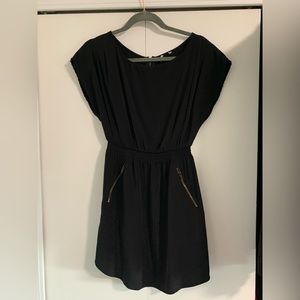 Black dress with pockets and zipper accents. Size small